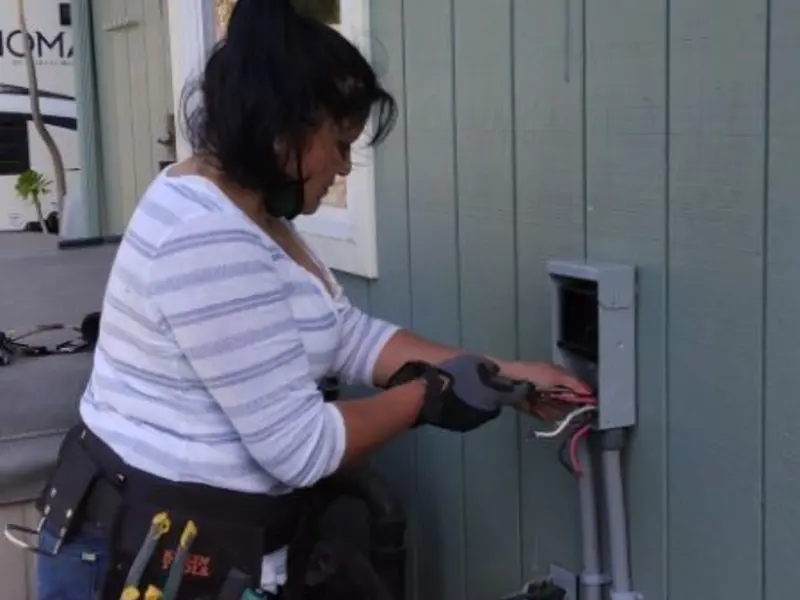 Licensed electrician wiring an exterior subpanel in Columbia